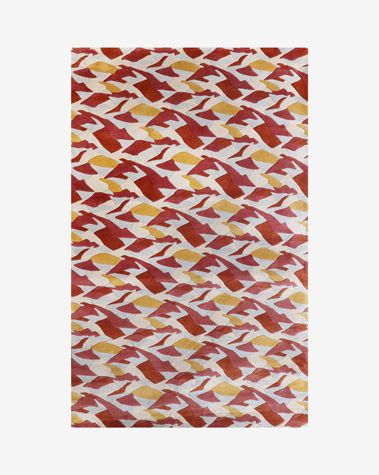 As a merino wool rug, our Mani pattern in Fire uses a palette that includes white, sand, light blue, and terracotta red