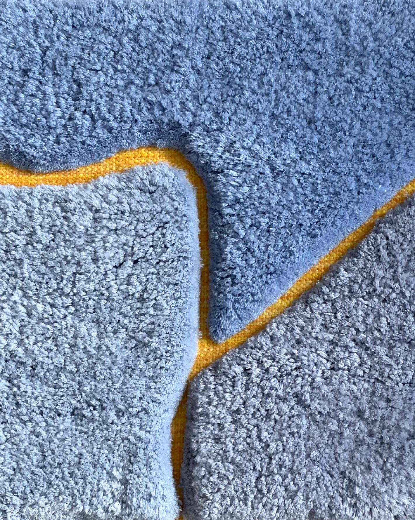 In this swatch of the Sky and Sun colorway, Eskayel’s Pieces rug offers a palette with yellow, orange, and blue.