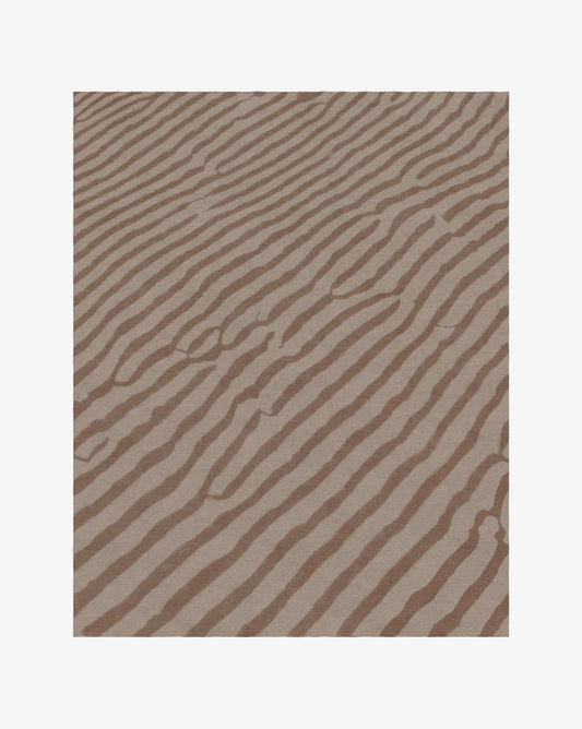 The Sand Lines rug in Earth offers a duotone brown colorway in softest merino wool. 