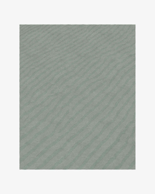 The Sand Lines rug in Sage incorporates two tones of green in soft merino wool.