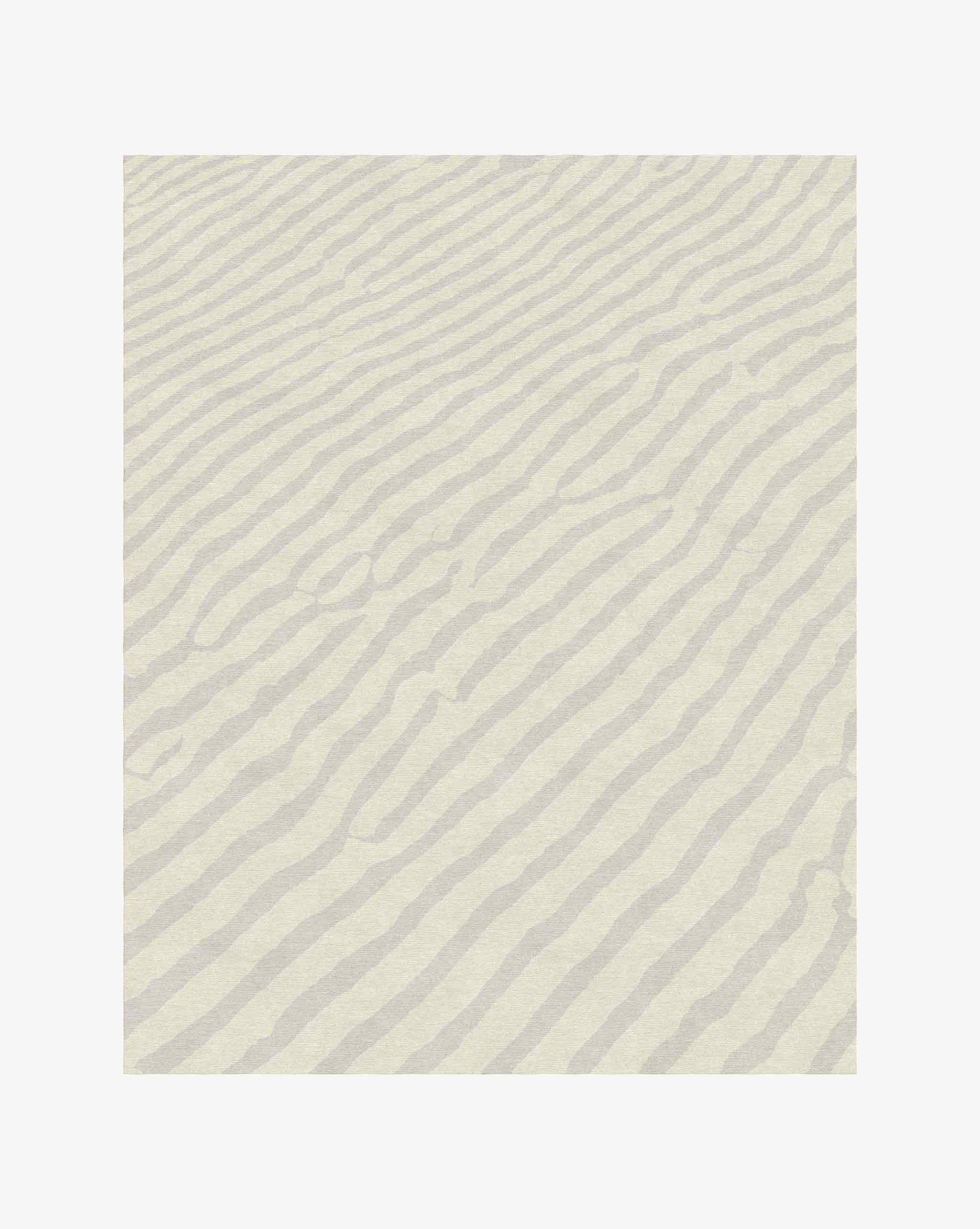 Made of soft merino wool, Eskayel’s Sand Lines rug in Sand is a colorway of beige and grey.