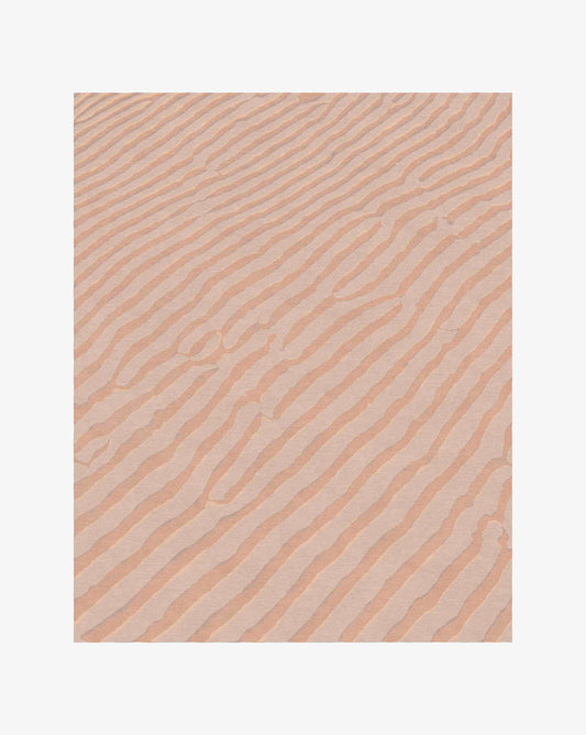 Eskayel’s soft Sand Lines rug in Sienna offers a colorway of two orange-based tones. 