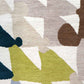 A close up of a Triangle Checks Hand Knotted Rug Multi with geometric shapes on it
