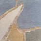 Close-up rug image of Pieces Mineral – a multicolored oval-shaped area rug with a geometric pattern | Eskayel
