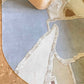 A cropped image of our hand-knotting studio-designed Pieces Mineral rug, a multicolored oval-shaped rug with a geometric pattern | Eskayel