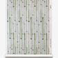 A green and white Bamboo Stripe Grasscloth Brush wallcovering on a roll