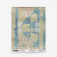 A blue and green Banda Grasscloth Banana tie-dye pattern on wallpaper