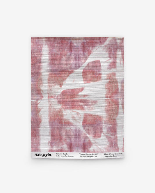 a Banda Grasscloth Sample Persimmon of the pink and white tie dye pattern on wallpaper