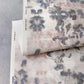A piece of Clemente Grasscloth Sol wallpaper with a floral pattern on it