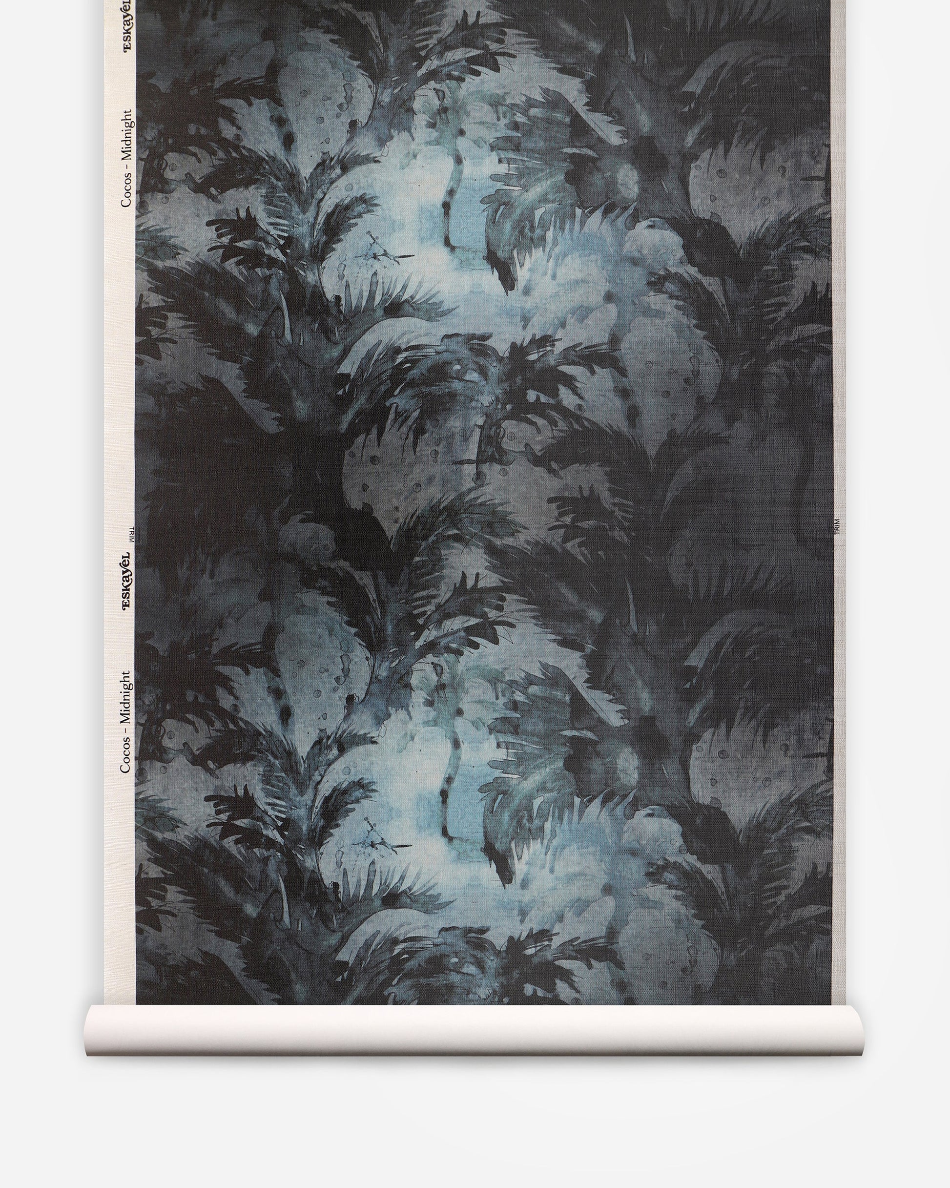 A roll of Cocos Grasscloth Midnight with palm tree motifs and a black and blue pattern
