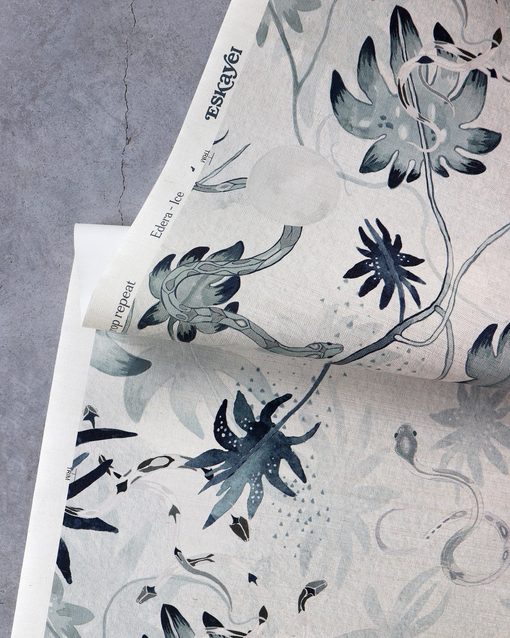 A floral chinoiserie-inspired pattern on an Edera Grasscloth Ice piece of paper in collaboration with Eskayel