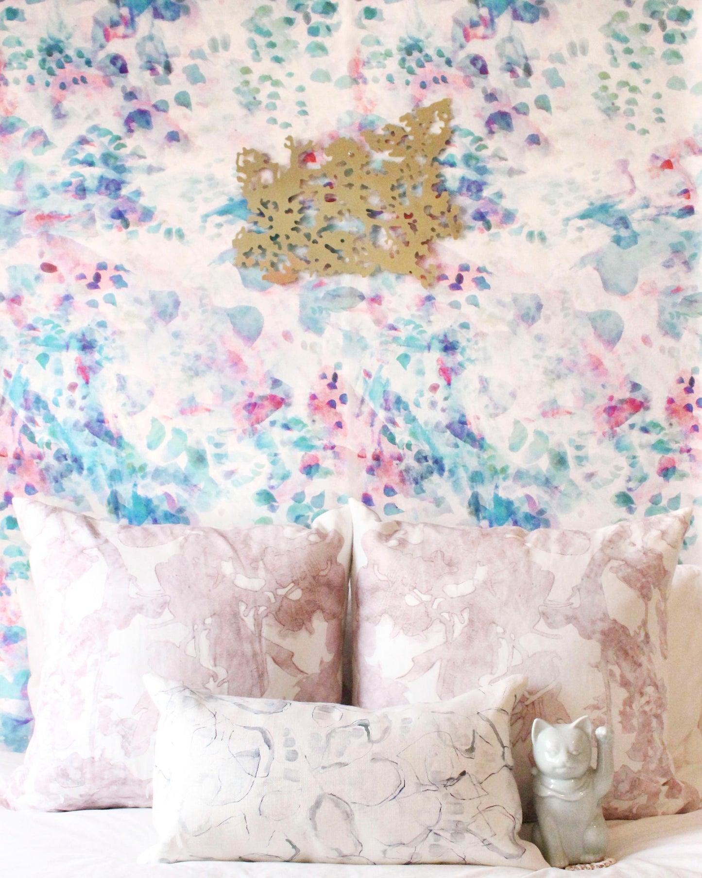 A bed with pillows and custom Felidae Wallpaper||Spectra.