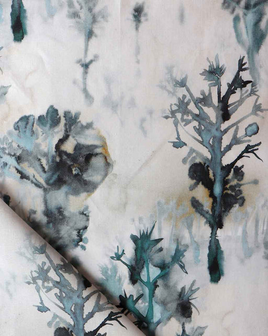 A close up of a high-end Aionas Fabric||Isthmus with macro-print trees featuring the SEO keyword "Aionas".