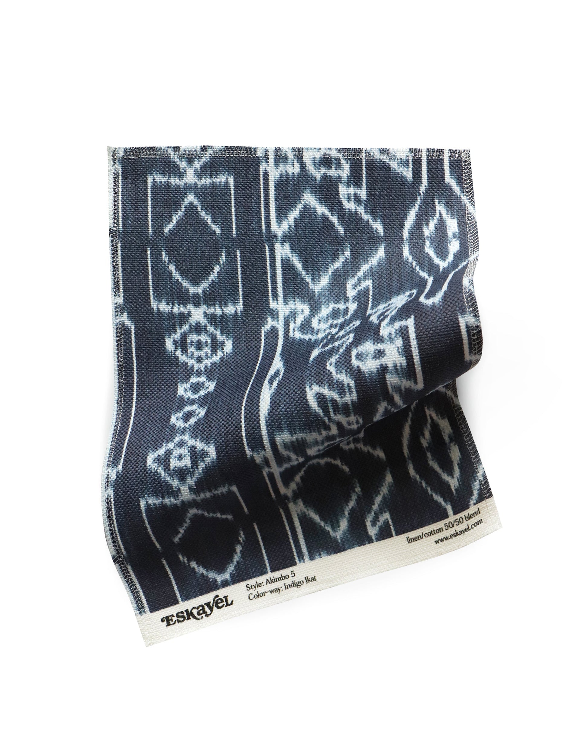 a sample of the Akimbo Fabric Sample Indigo Ikat with a geometric pattern