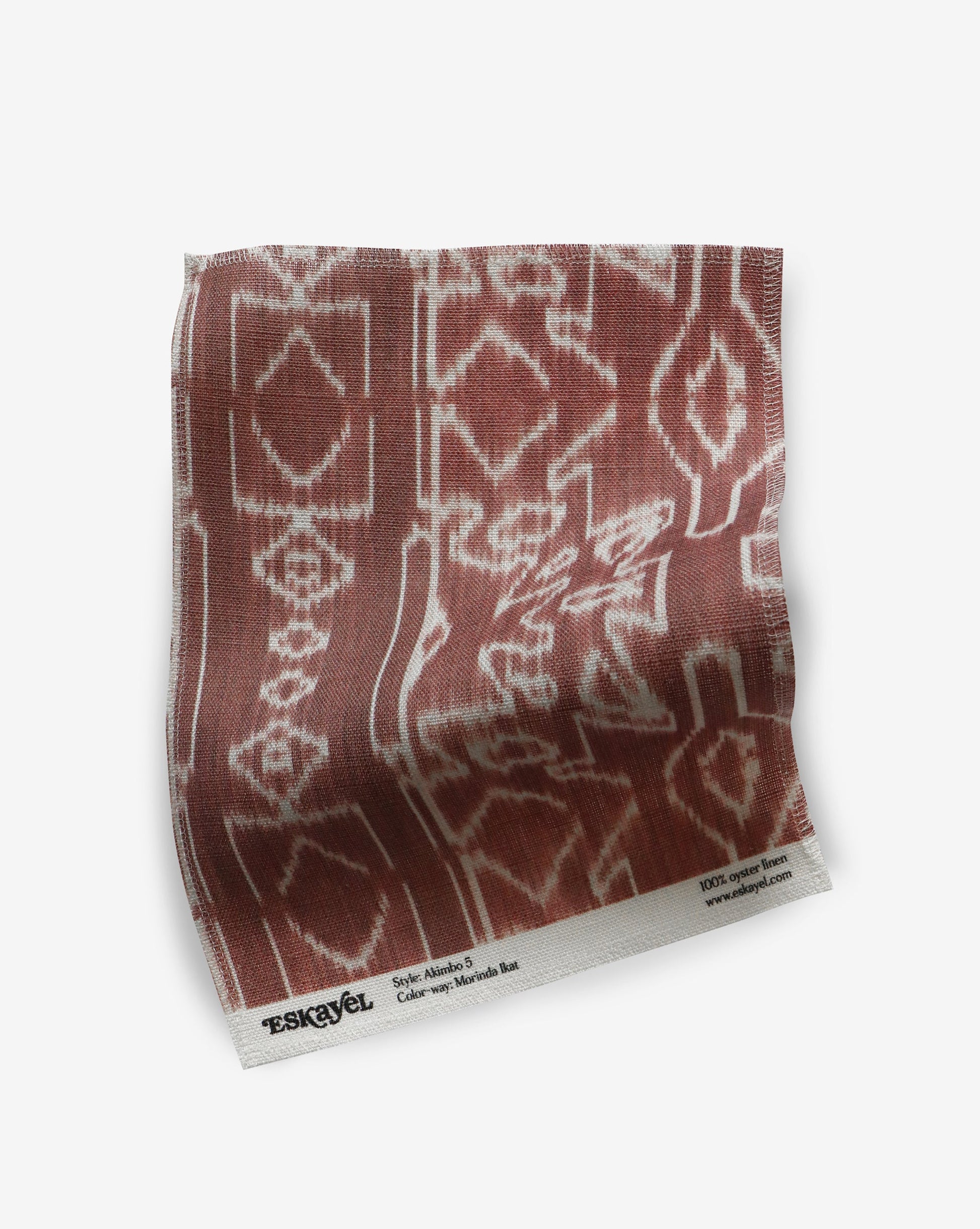 An Akimbo Fabric Sample with a pattern on it. || A Morinda Ikat Fabric Sample with a pattern on it.