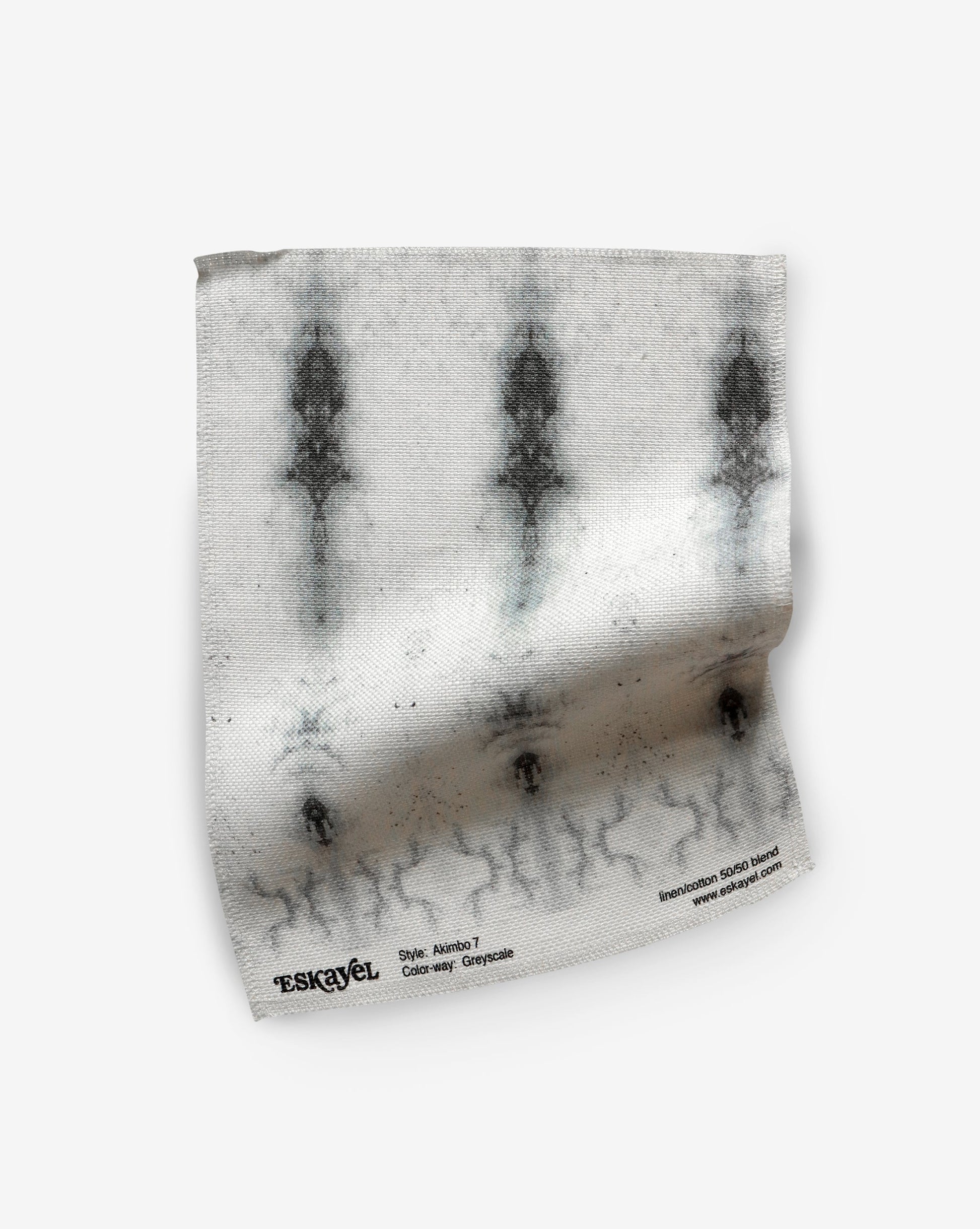 A versatile Akimbo 7 Fabric Greyscale fabric with a graphic geometric pattern