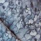 A close up of a blue and white Aquarelle Fabric in the Ocean colorway
