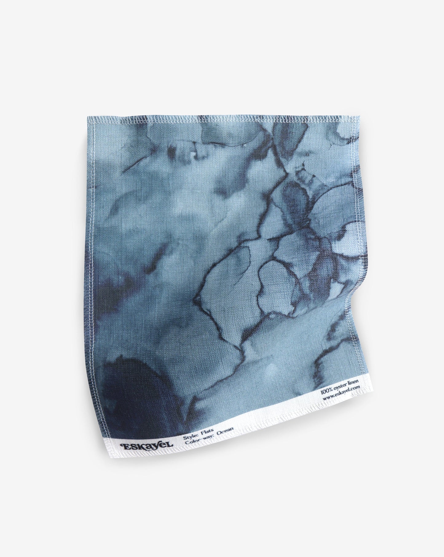 A blue marble print on a white background, featuring the Aquarelle Fabric in the Ocean colorway