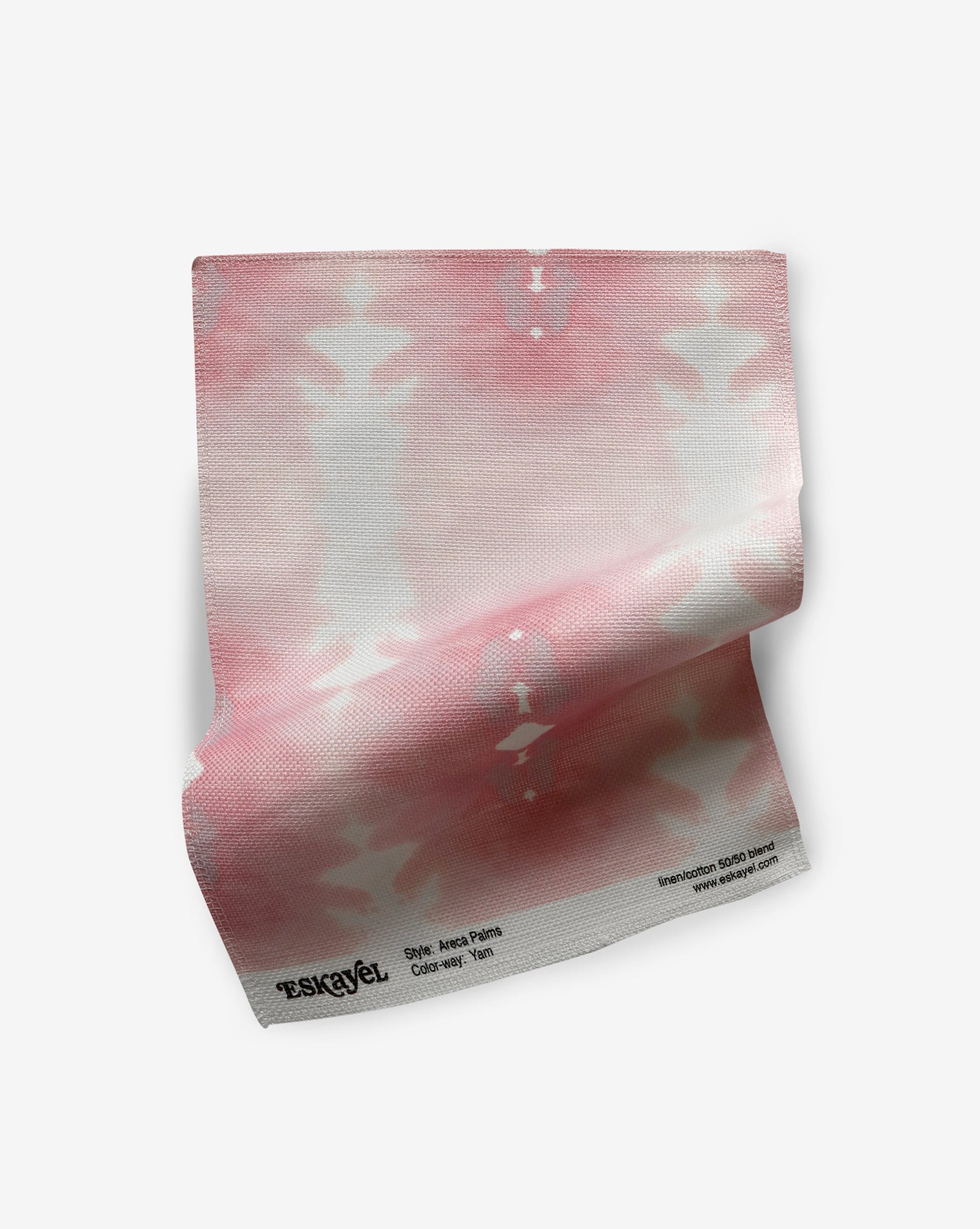 A pink and white tie dye pattern inspired by the oceanic art of the Kwoma people on a piece of Areca Palms Fabric Yam