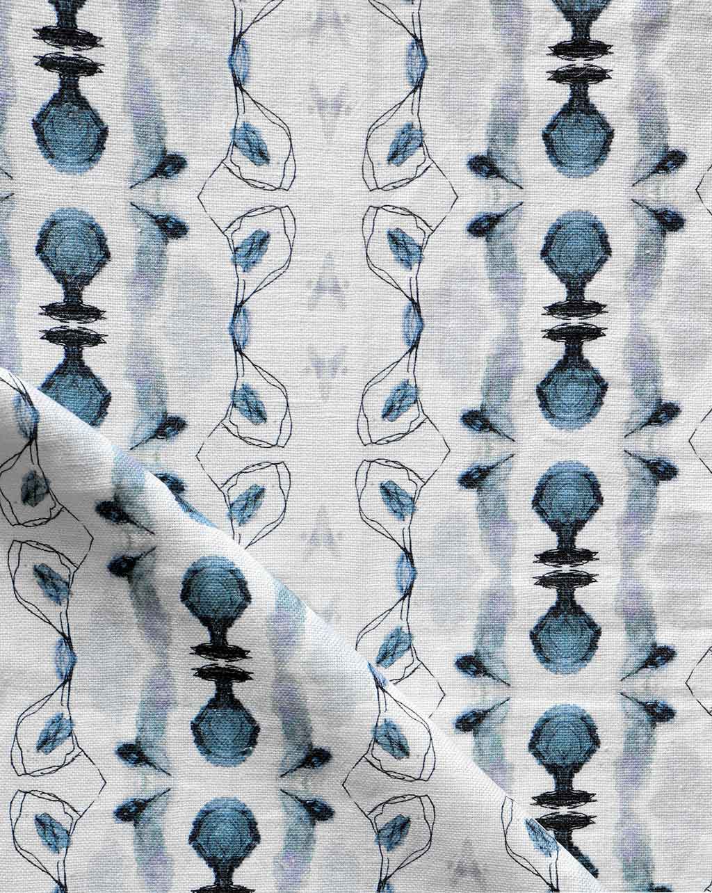 A Bali Stripe Fabric Indigo with an abstract design