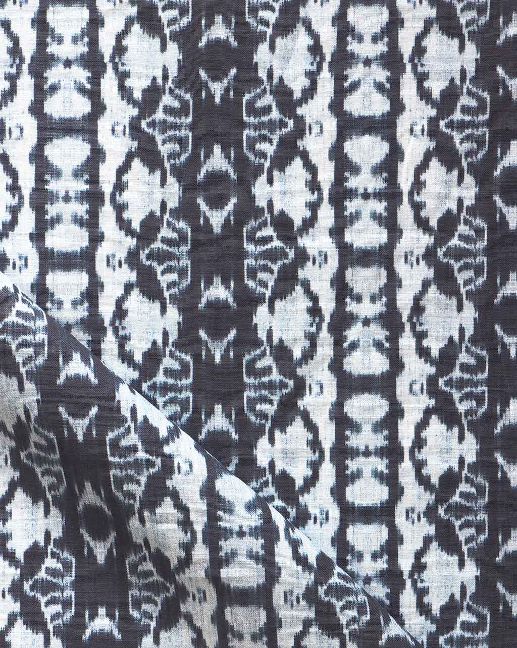 A close up of a luxury fabric, the black and white Bali Stripe Fabric Indigo Ikat