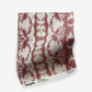 A red and white Bali Stripe Fabric or Morinda Ikat print on a white background, ideal for luxury fabric.
