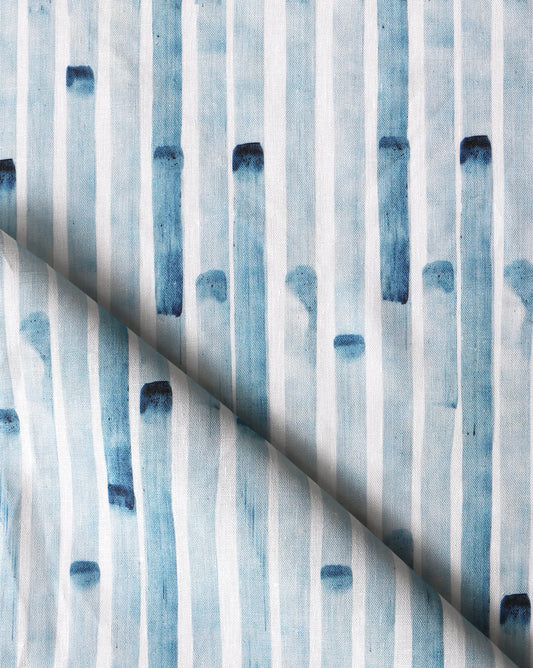 A close up of blue and white striped Bamboo Stripe Fabric Azure from the Eskayel wallpaper range