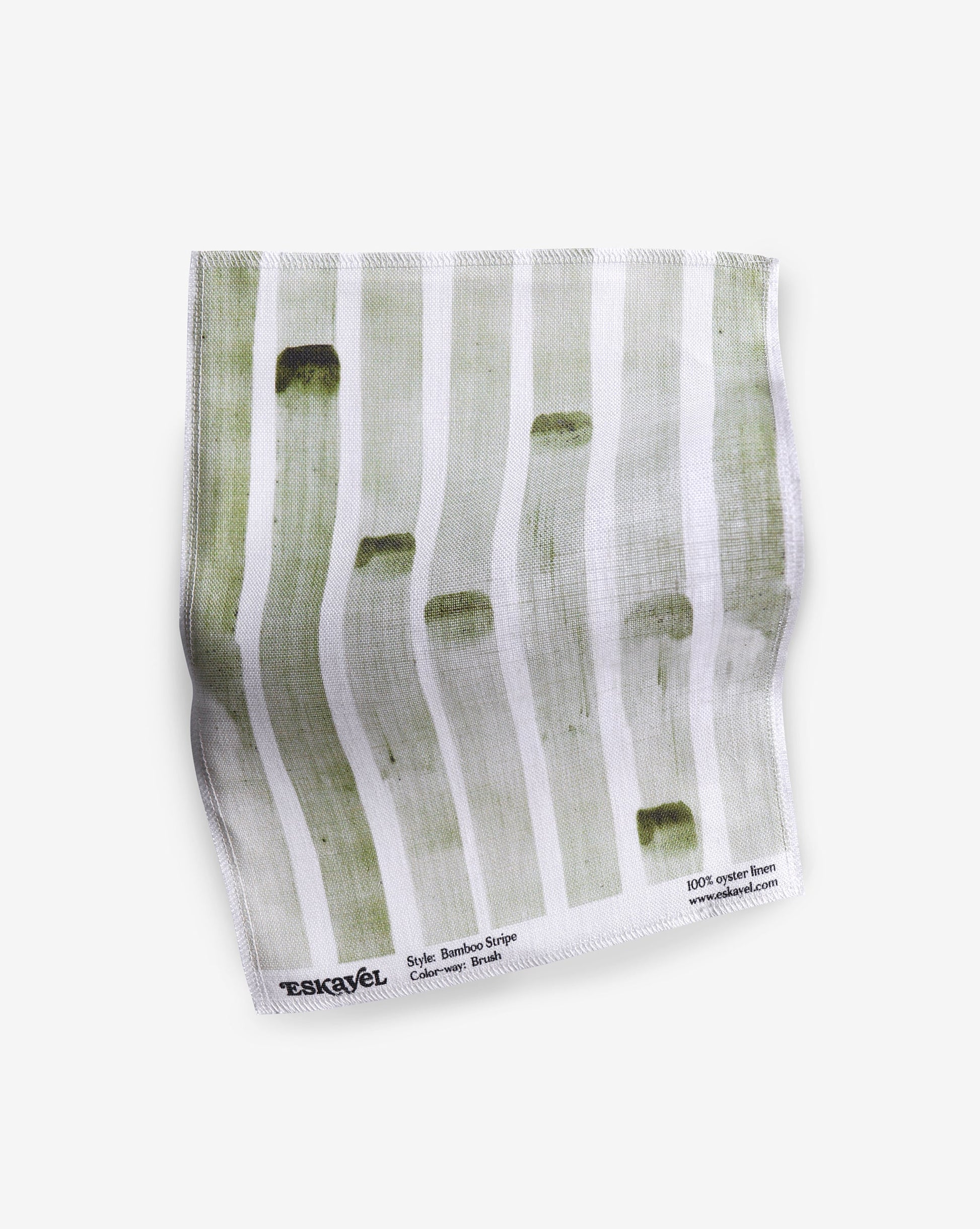 a sample of the Bamboo Stripe fabric with green and white stripes on it