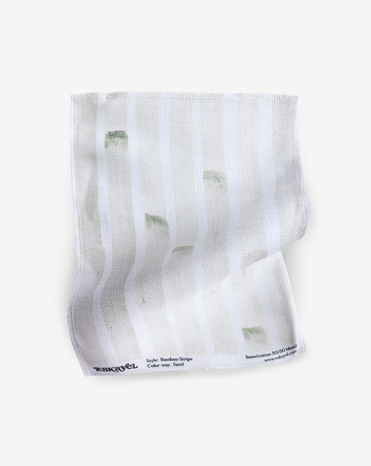 A white fabric with green stripes on it is available for order Product Name: Bamboo Stripe Fabric Sample Sand