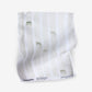 A white Bamboo Stripe Fabric hankerchief with green stripes on it.