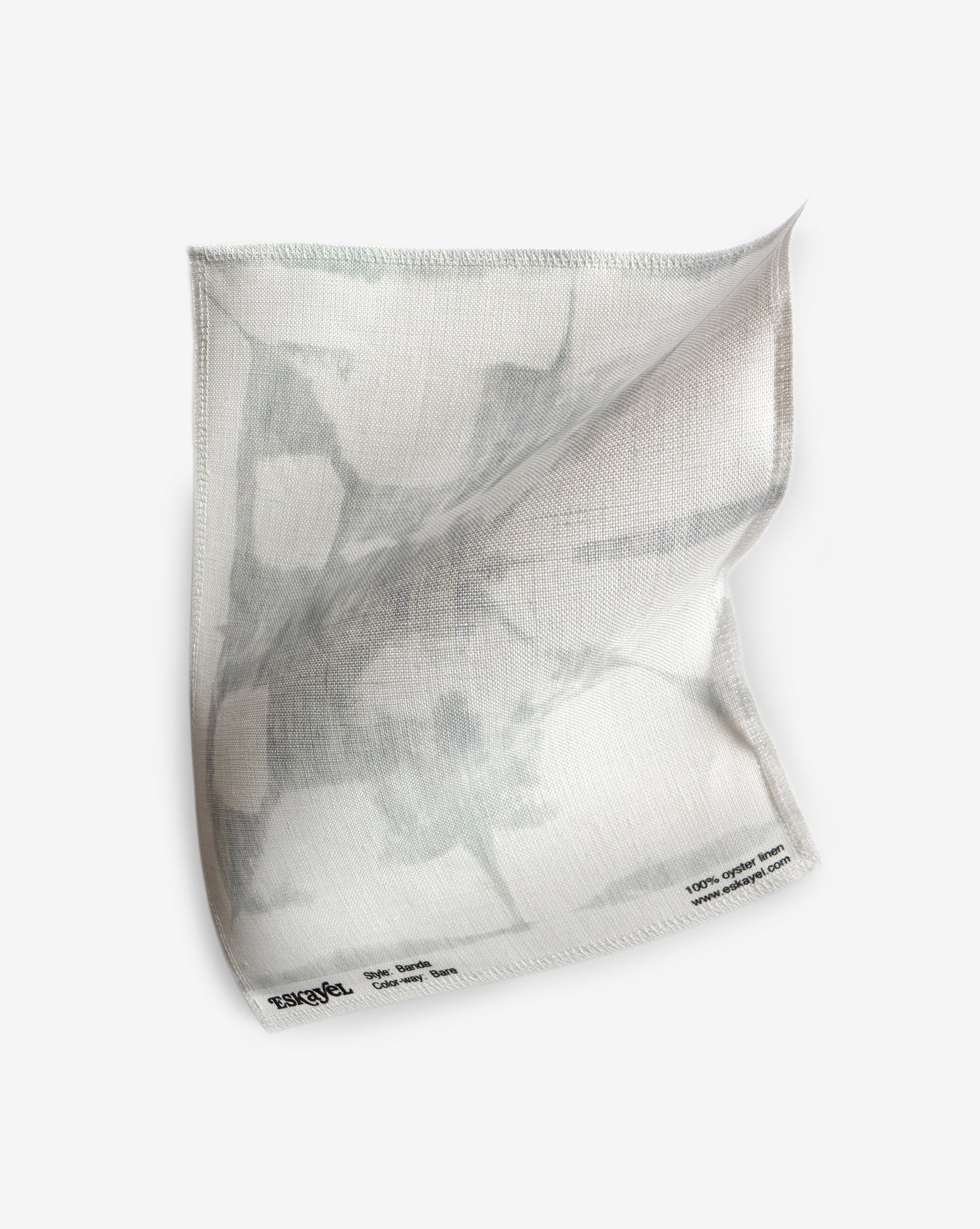 A white and gray shibori tie-dye Banda Fabric Bare on a white surface
