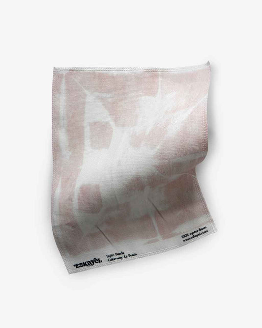 A Banda Fabric Sample Light Peach fabric on a white surface can be ordered