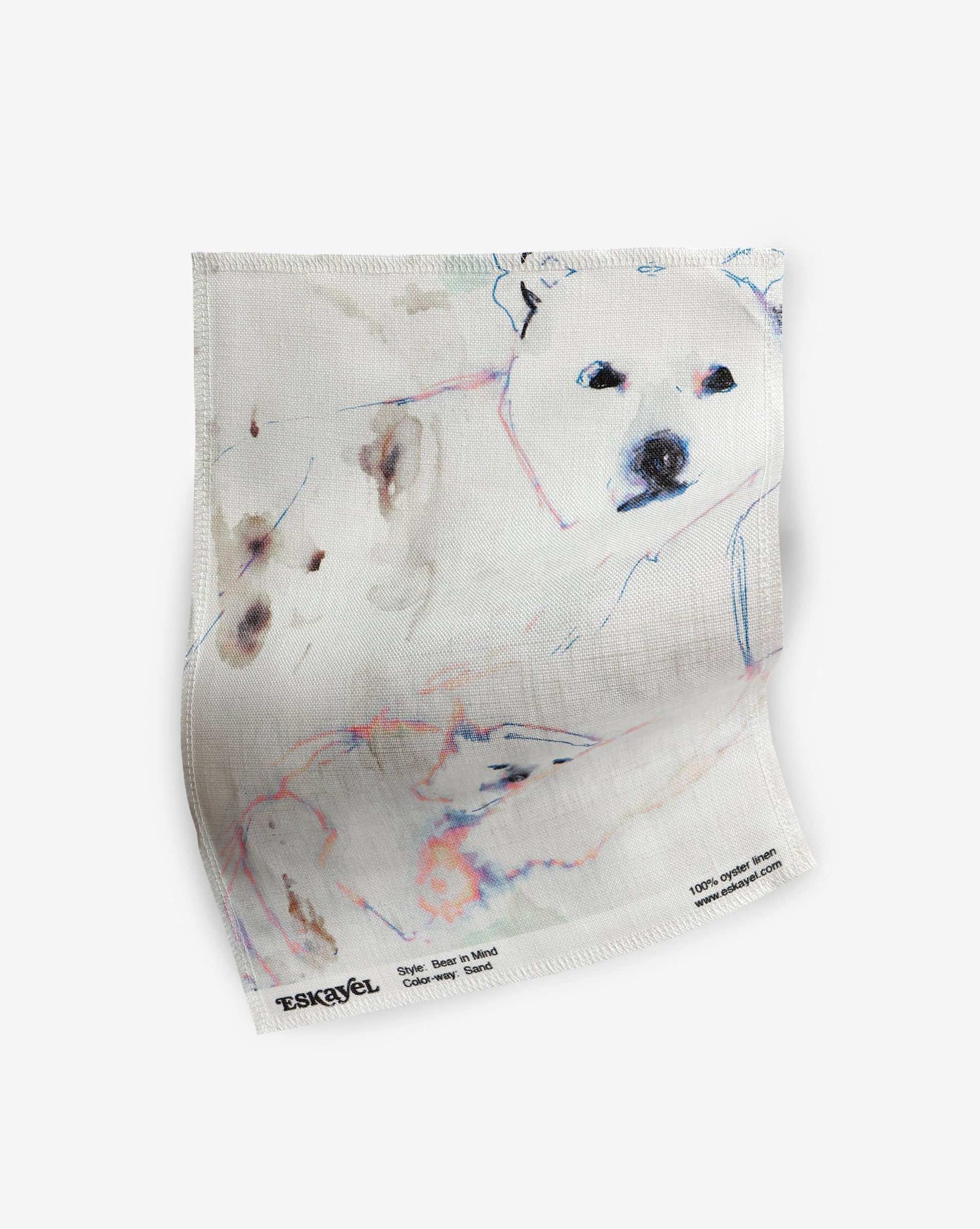 A white fabric with "Bear in Mind Fabric Sand" on it