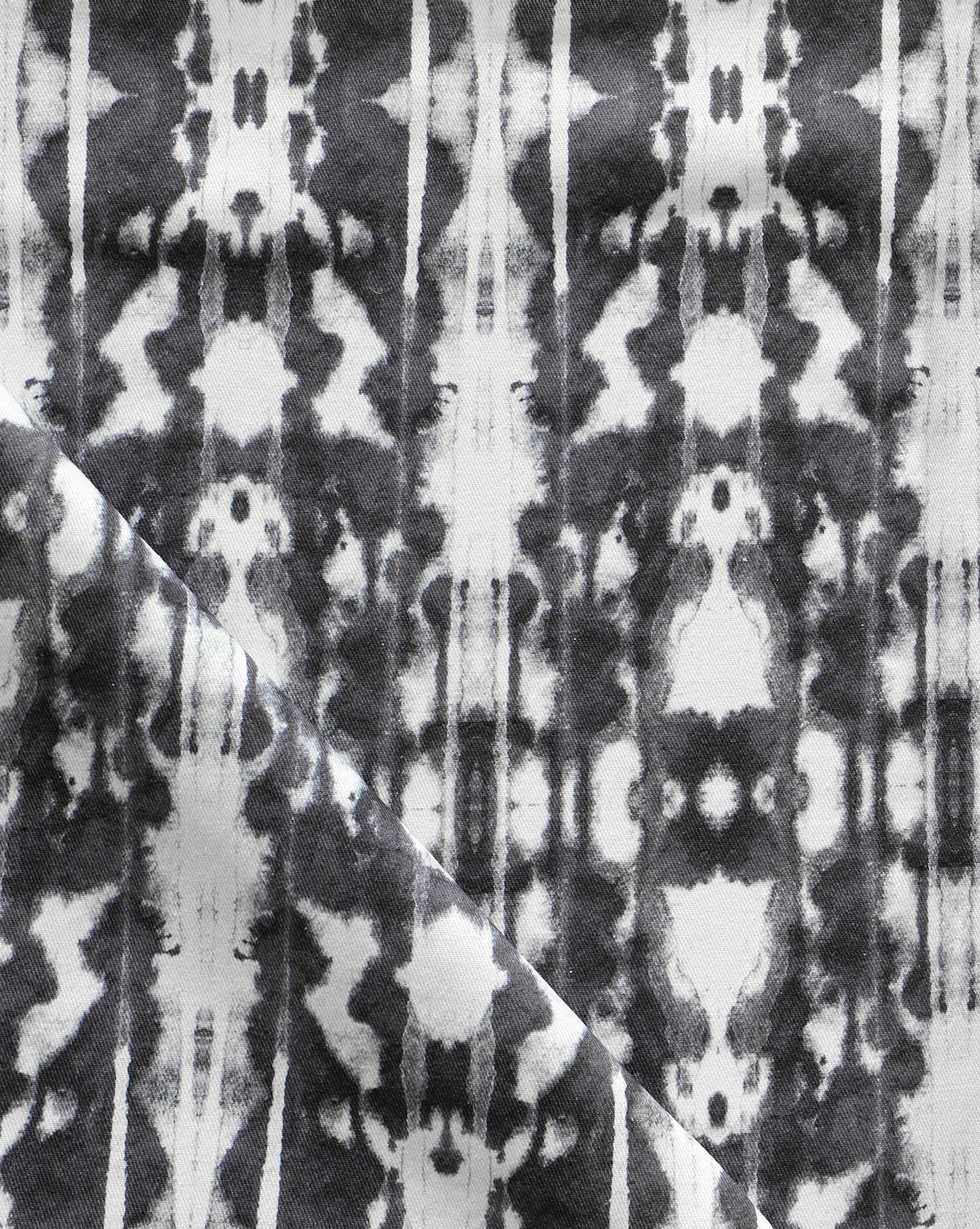 A close up of Biami Fabric||Black, a high-end black and white tie dye fabric.