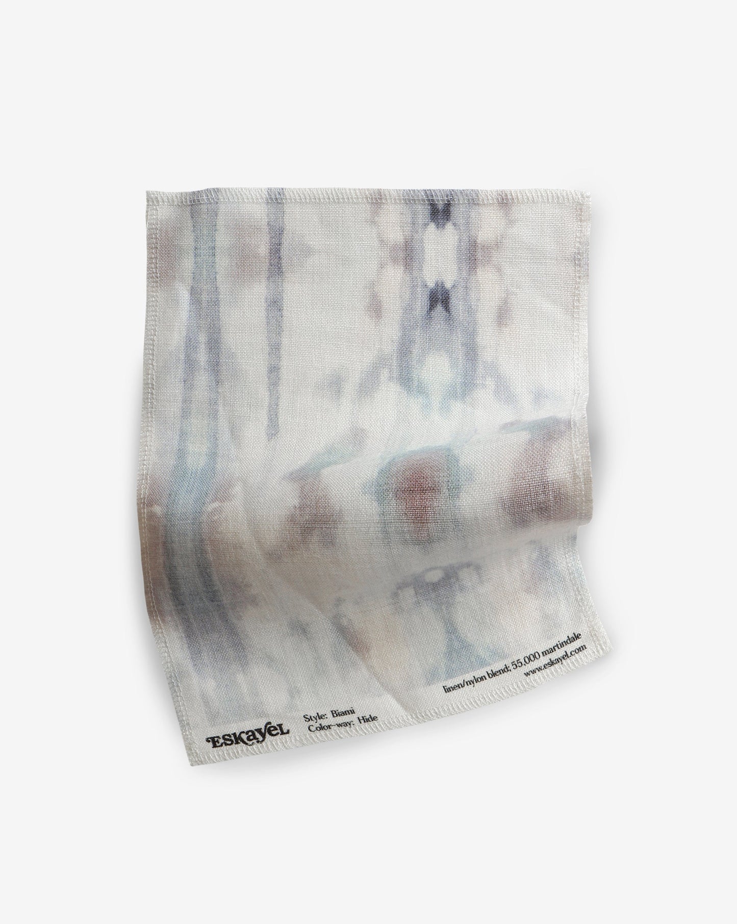 A blue and white tie dyed Biami Fabric on a white surface