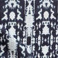 A close up of a high-end black and white Biami Fabric Indigo Ikat fabric with the Biami pattern