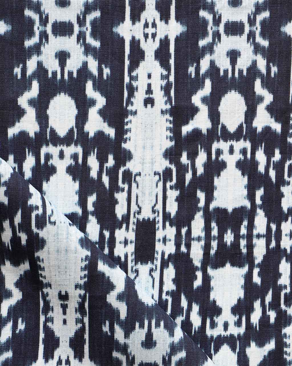 A close up of a high-end black and white Biami Fabric Indigo Ikat fabric with the Biami pattern