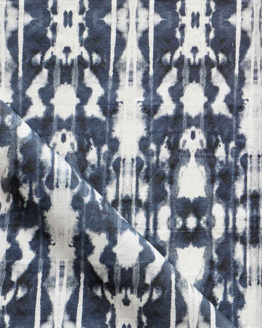 An image of a high-end Biami Fabric Nila pattern featuring a blue and white tie dyed fabric