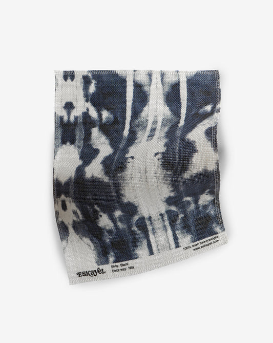 A Biami Fabric Sample Nila tie dyed sample on a white surface