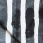 A high-end wallpaper from the Bold Stripe Fabric Slate Collection, featuring black and white stripes