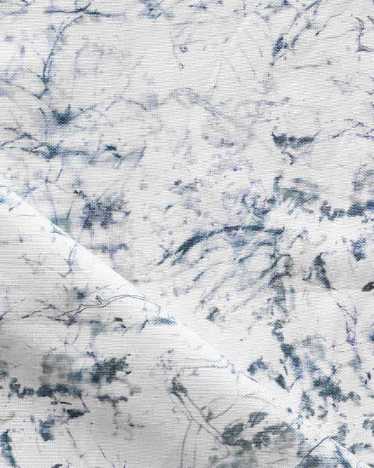 A white and blue marbled Bosky Toile Fabric Midnight, suitable for wallpaper or luxury fabric décor