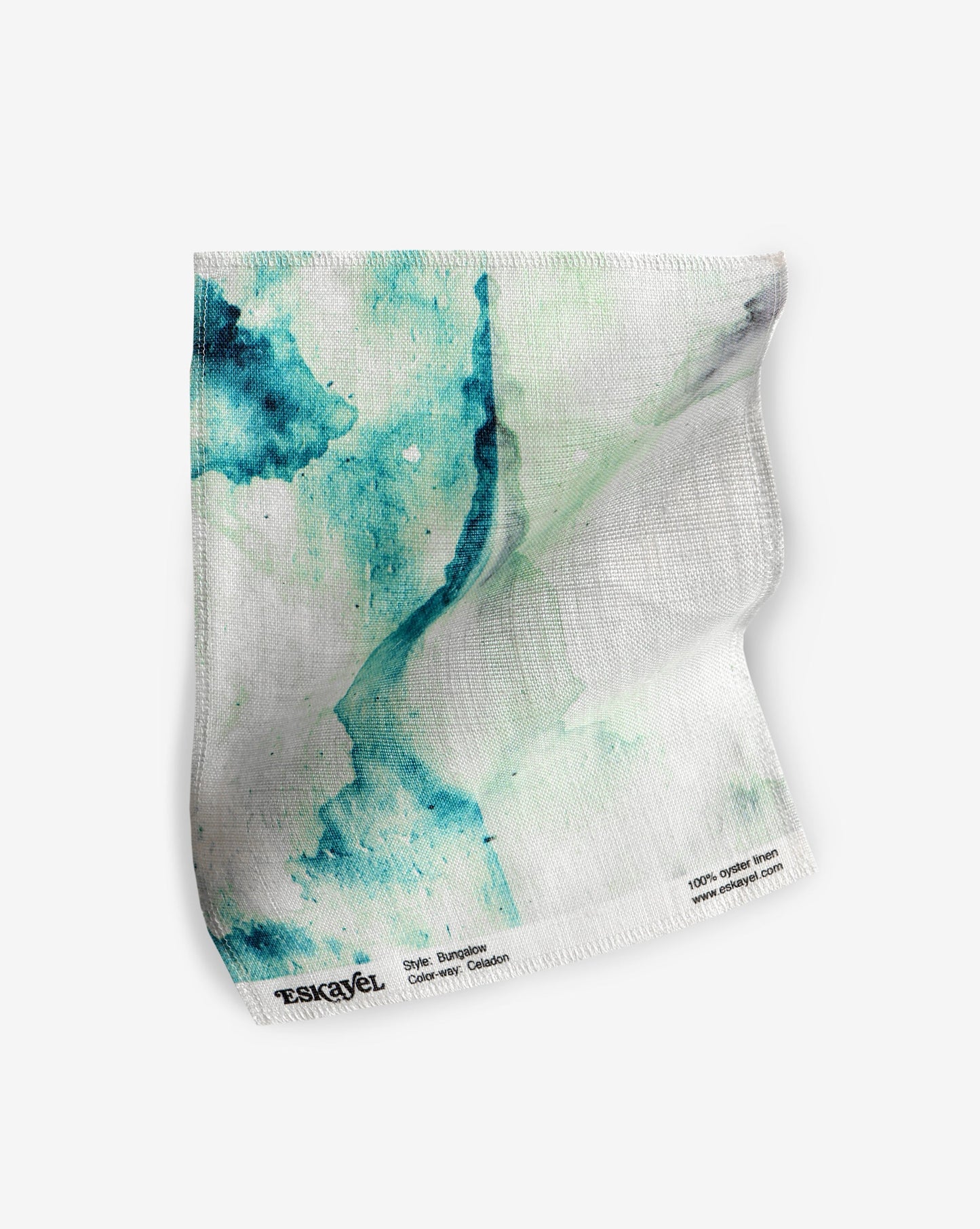 A hand fabric with a watercolor design from the Bungalow Fabric Celadon capsule collection