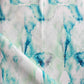A blue and white fabric with a watercolor Bungalow Fabric pattern