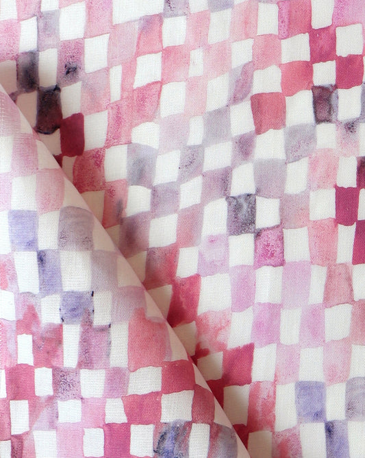 A close up of a Chess Fabric Coral checkerboard pattern