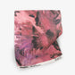 A luxury pink and black Cocos Fabric Persimmon painting on a piece of fabric featuring palm tree motifs
