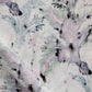 A close up of Cocos Fabric Cay with a pink and purple palm tree motifs pattern