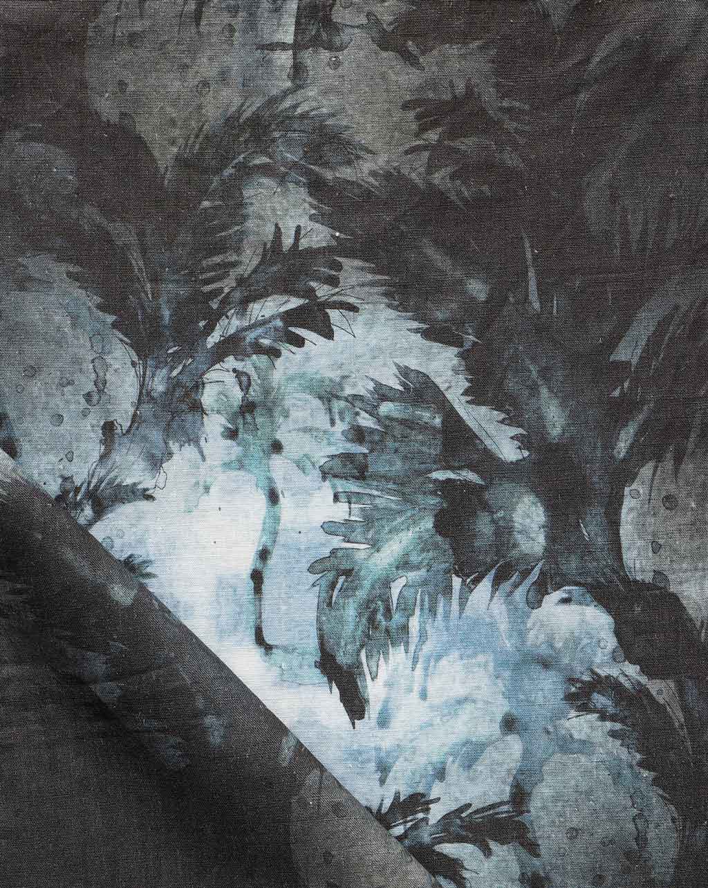 A close up of Cocos Fabric Midnight with a palm tree motif on it