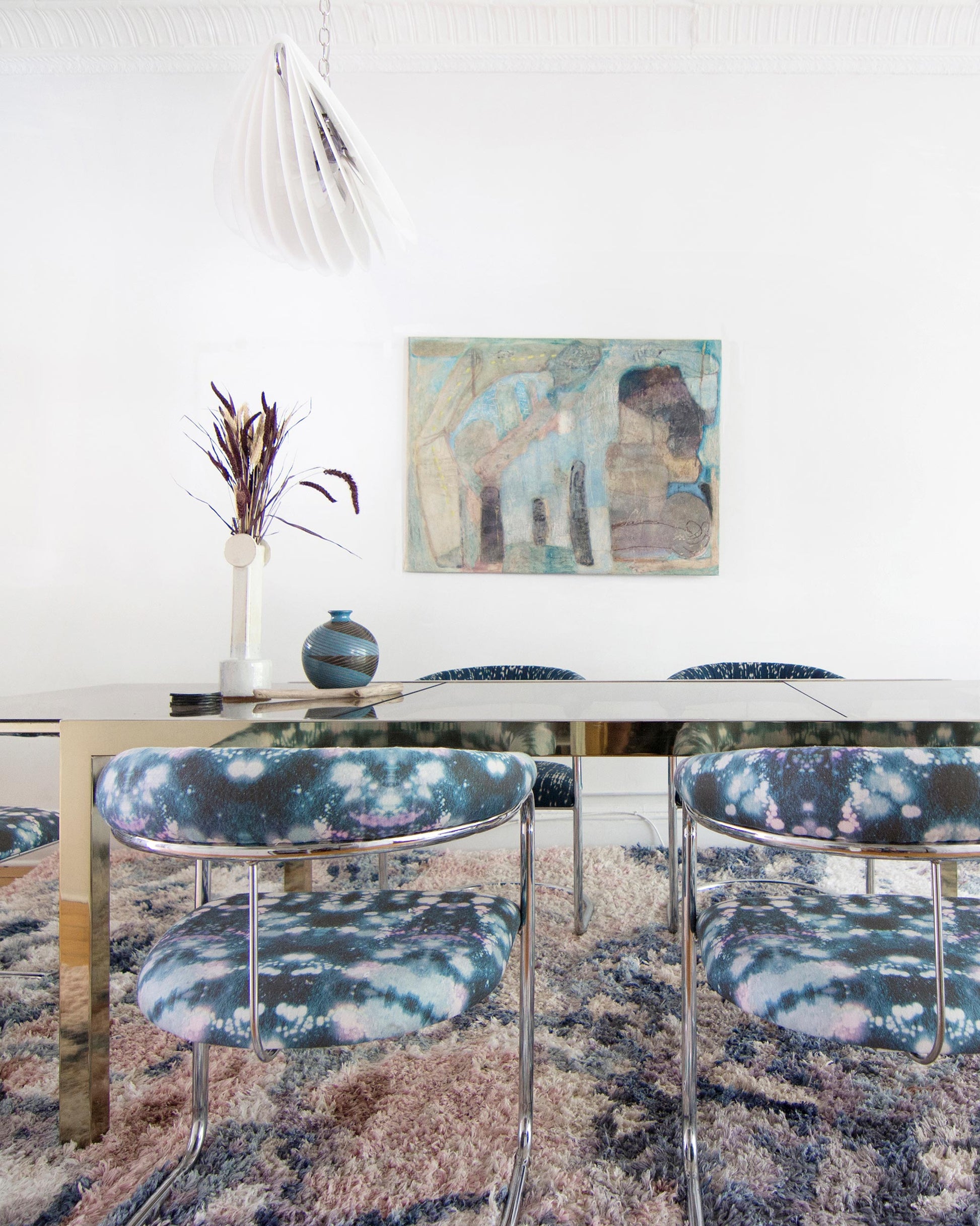 A dining room with Solar Fabric Nila table and chairs is transformed into a celestial cosmos