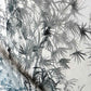 A close up of a black and white painting of a palm tree from the Domenica Fabric Notte Collection