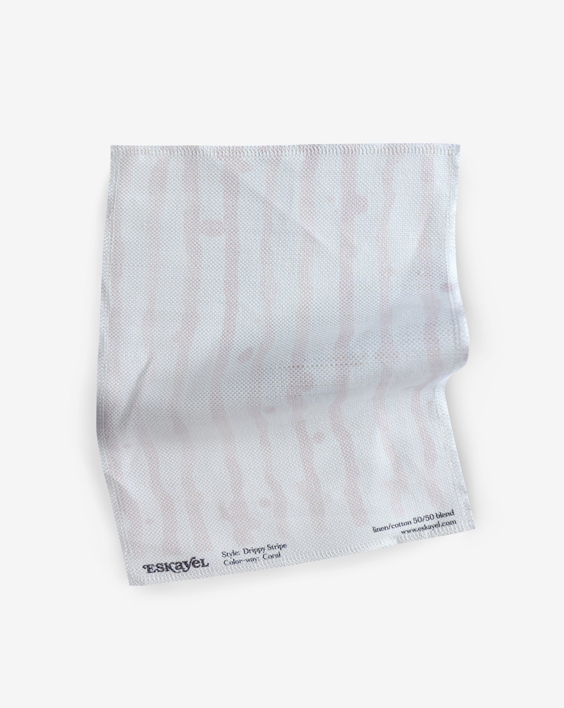 A white Drippy Stripe Fabric Coral with pink stripes on it